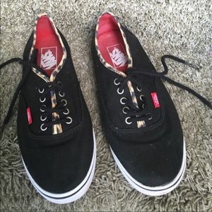 Black vans with cheetah trim